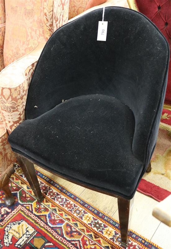 A black velvet tub frame side chair